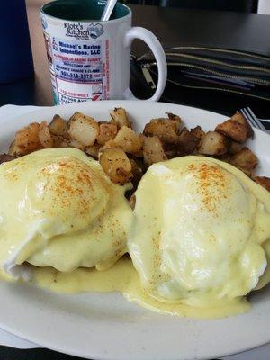 Country benedict, with sausage and biscuit instead of Canadian bacon and English muffin