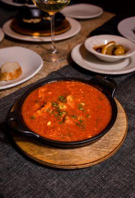 Shrimp Ouzo, shrimps sautéed in olive oil with Ouzo along with garlic in house tomato sauce