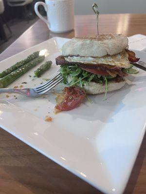 Breakfast sandwich-Applewood Bacon, fried egg, arugula and aioli on english muffin. Nice touch of grilled asparagus and tomato