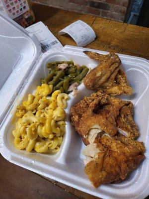 Fried chicken breast, a wing, mac-n-cheese and delicious green beans