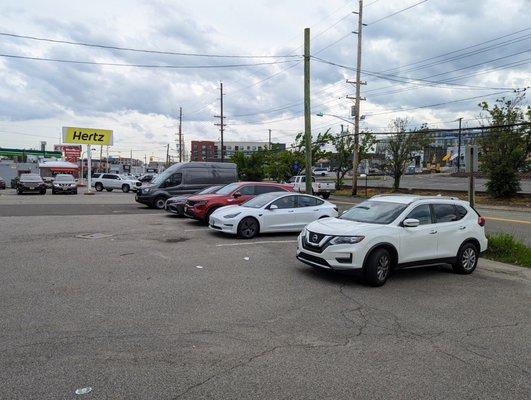 Parking lot of cars shortly before closing.