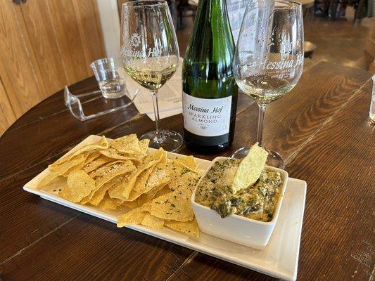 Spinach artichoke dip with sparkling almond wine