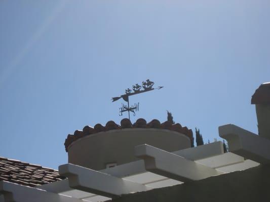 Experts even at mounting a weathervane.