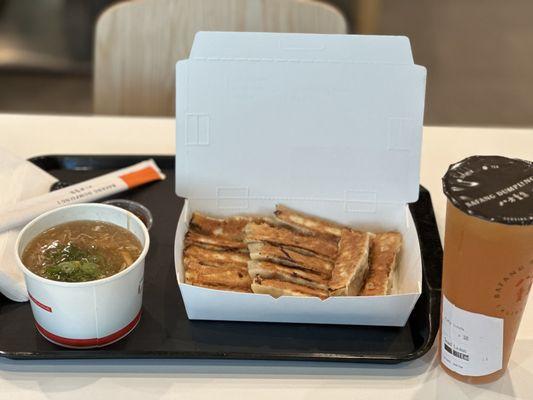 Combo 1 (signature potstickers & hot and sour soup) with a lemon black tea.