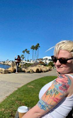 shoulder was done by another artist in SF- Mike, at Eden blended the shoulder tattoo with the palm trees, blending it into the sky. GENIUS!