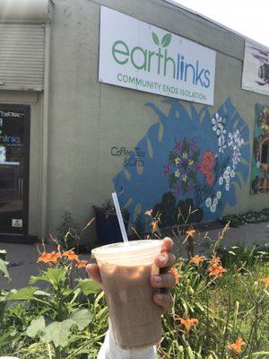 Iced chai latte with oat milk! Pic taken outside the Earthlinks shop!