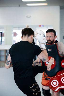 Coach Bagby working with TUFF 28 Champion and UFC fighter Macy Chiasson in our noon Muay Thai/Kickboxing class.