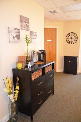 Comfortable waiting area with tea and coffee