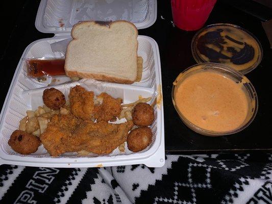 Catfish (sorry, it's half eaten lol), hush puppies and fries. That dipping sauce, magnificent.