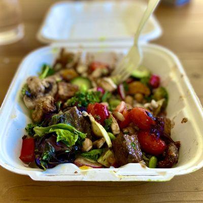 Salad  With smoked tofu, mixed greens, sun dried tomatoes, edamame, avocado, mandarin, and chickpeas.