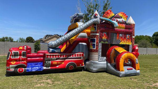 Firehouse Double Slide Bounce House Rental! This Firehouse Bounce House with an Inflatable Double Slide and Basketball hoop w...