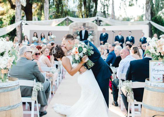 Happy newlyweds at the Garden ceremony site at this Ventura County wedding venue