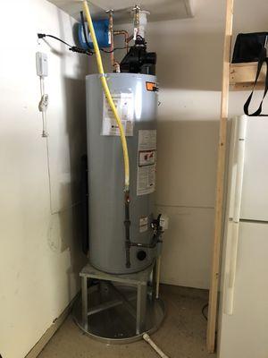 50gal has power vent water heater on a stand.