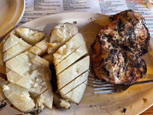 Baked potato and chicken breast.