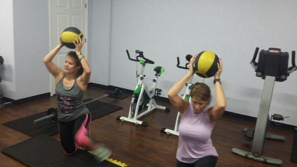 Clients doing a basic exercise, that works the whole body.