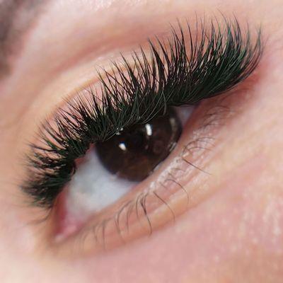 Creative eyelash extensions. Lash color black and green