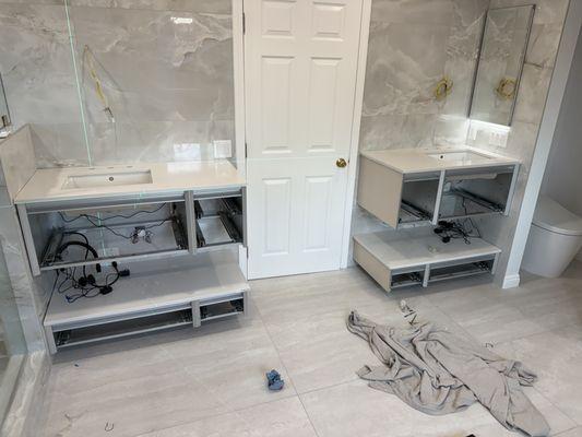 installation of wall cabinets with marble countertops 2 sides on the same level