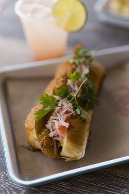 Coconut Shrimp Po'boy (coconut shrimp, mango apricot sauce, jicama slaw, and cilantro)