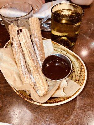 Churros. Perfect. Nice and hot. Topped with sugar and served with Spicey hot chocolate to dip in.   Slaps!