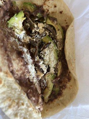 Inside of a Baleada especial (carne asada + avocado, no huevos)