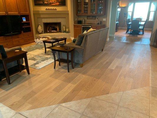 Family from and dining room with lots of tile transitions.