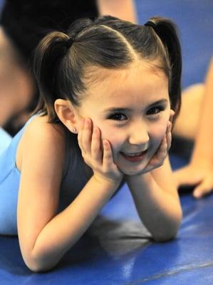 Ella watching the older gymnasts at the Gala