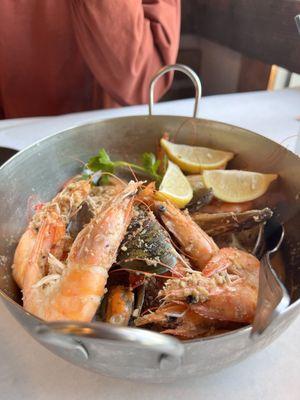 Shrimp, green mussels, and potatoes with lemon pepper seasoning