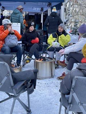 Folks enjoying the smokeless warmth of a couple of Solo Stoves at an ice climbing festival. :-)