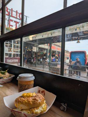 Enjoying breakfast bagel sandwich at the counter right next to the Bagelbop stand.