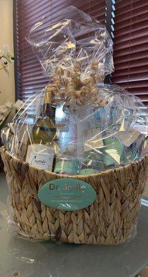 Call us to join the raffle: This amazing gift basket is filled with an electric toothbrush, teeth whitening and other goodies.