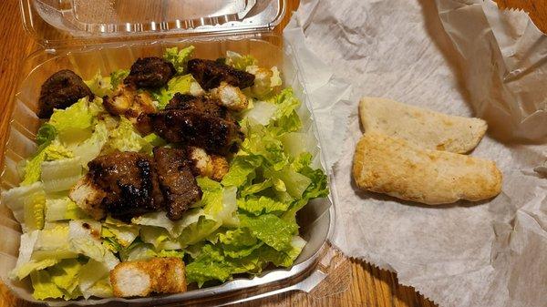 Steak tip Caesar salad with pita bread...or what resembles pita bread.