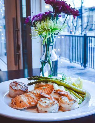 Seafood Lover, seared salmon, scallop, and shrimp, seafood risotto, asparagus, lemon butter drizzle