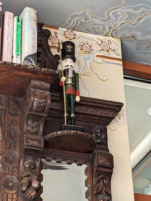 Nutcracker reminder atop a little library...