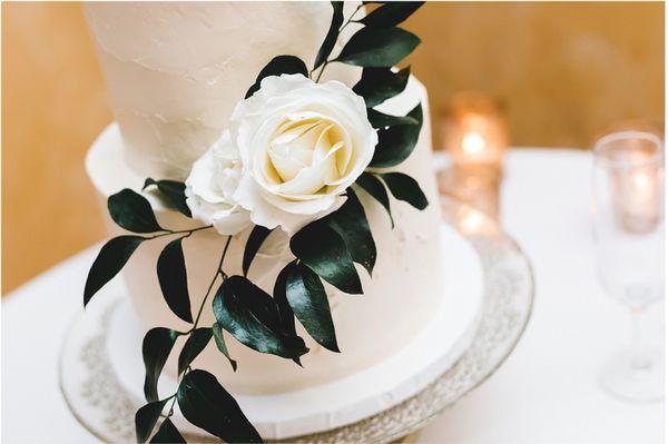 Asked Rhiannon for a simple cake with taller tiers, a "plaster-like" texture, and for greenery to trail down the cake.