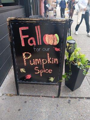 Signage about pumpkin spice latte