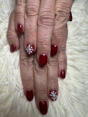 Sns dip Ken did clear on my mom's hands and red gel polish and hand drew her designs and poured white glitter over.