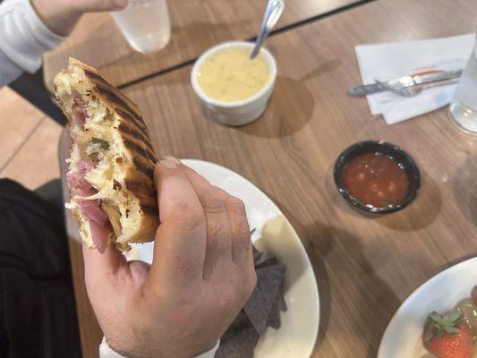 Chipotle chicken panini melt w/ chips, salsa and broccoli cheese soup