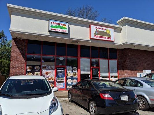 Outside. Storefront. Entrance. Located next to the Chevron convenience store on Atlanta Rd.