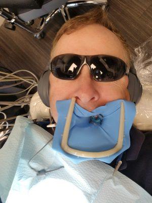 A selfie taken during a pause in the root canal.