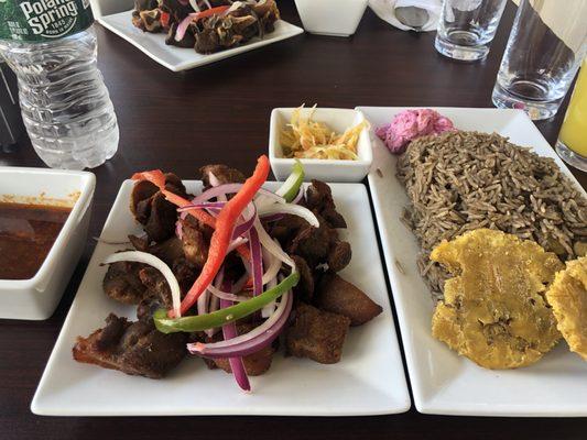 Fried pork, plantains and black rice.