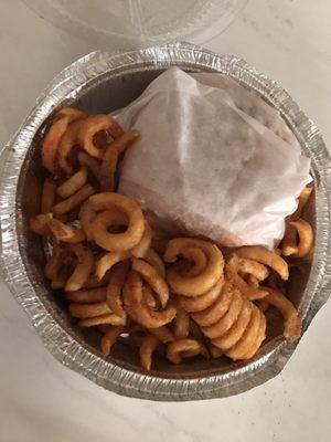 Cheeseburger with curly fries. Deluxe option (~$6) with soda not pictured.