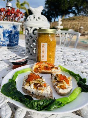 Wild gold pearl salmon caviar topped on chicken pate, honey, pickled veggies, artisan olive bread (gourmet delicious AF)!