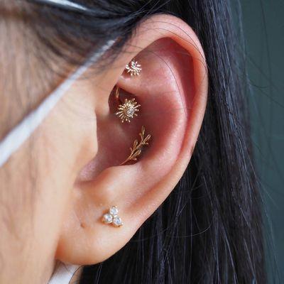 Rook, conch, and lobe piercing by Casey, jewelry by BVLA