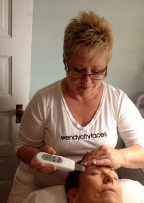 Wendy uses the latest in facial technology to give a client smoother, younger skin.