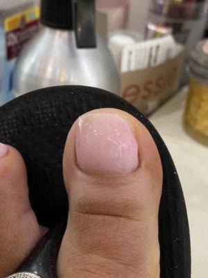 This is gel pedicure she cut my nail crooked