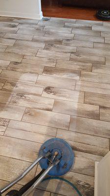 This floor was cleaned a year after construction was done. We pulled up alot of red clay dirt that the customer did not realize.