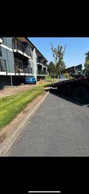 Pulling out car under some apartment.