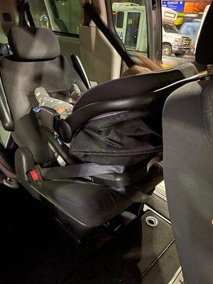 This is how they secure the car seat. SHAME. So many things are wrong here.