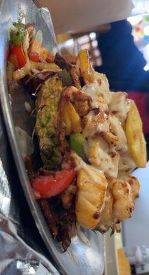 Hawaiian Fajitas (scallops, shrimp, chicken and steak with peppers, onions and grilled pineapple