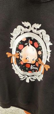 A black sweatshirt with a Kewpie doll.